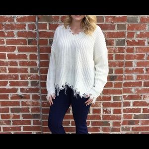 White fringed edged sweater